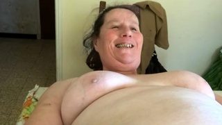 Chubby granny Annie on table – phone as sextoy close-up